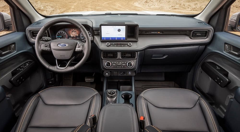 The black interior of a 2024 Ford Maverick Tremor is shown from above the center console.