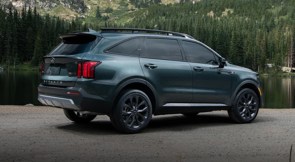 A grey 2021 Kia Sorento is shown from the rear at an angle after leaving a dealer that has used cars for sale in Victoria.