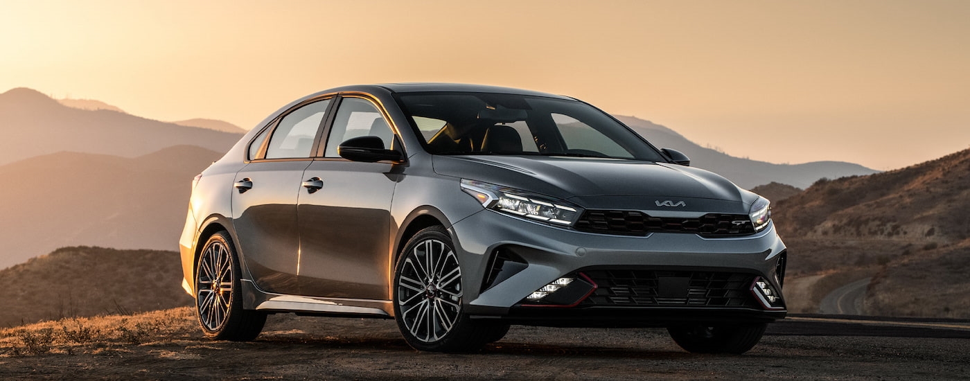 A grey 2024 Kia Forte GT is shown from the front at an angle.