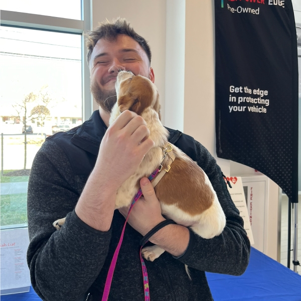 Man holding a puppy