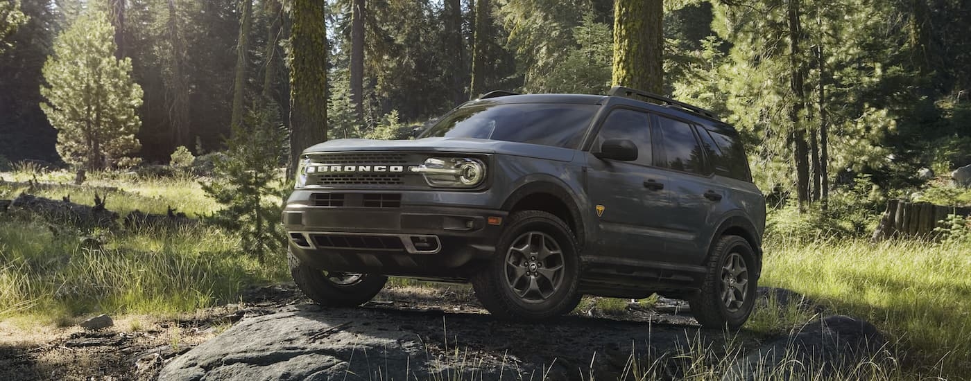 A grey 2024 Ford Bronco Sport Badlands is shown from the front at an angle after leaving a dealer that has a Ford Bronco Sport for sale.