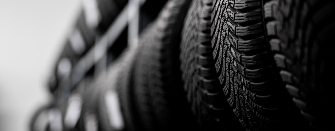 Tires are shown on a rack in close-up.