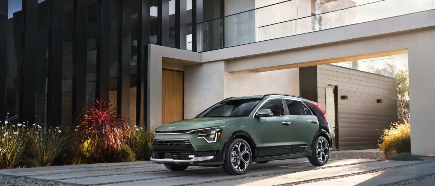 2024 Kia Niro parked by a modern building