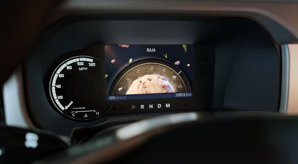 A close up shows the digital gauge and 'baja' mode in a 2024 Ford Bronco.
