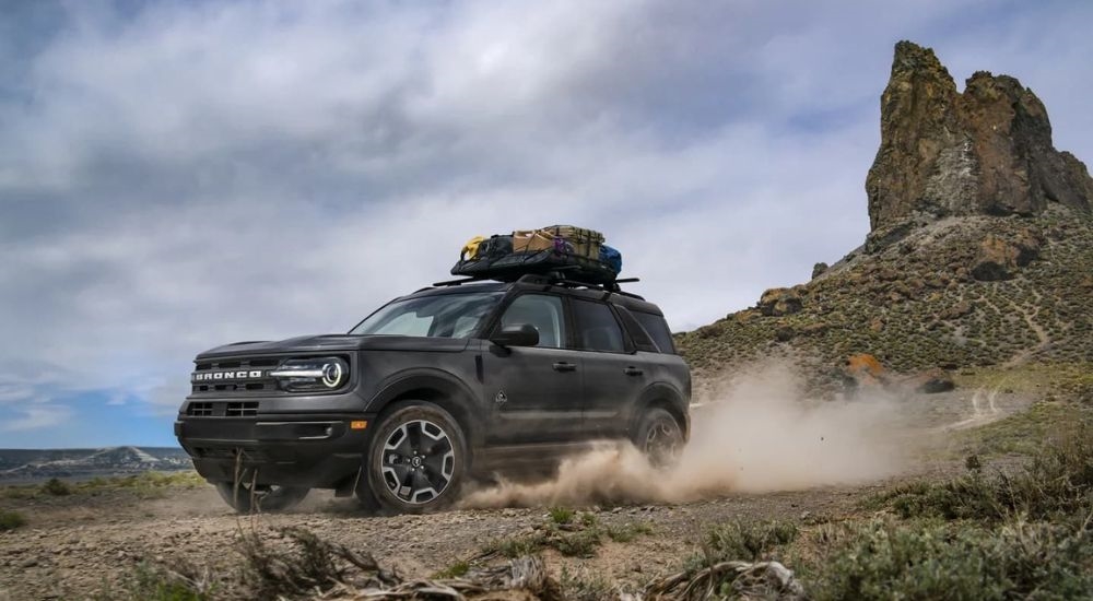 A grey 2024 Ford Bronco Sport Outer Banks is shown off-roading.