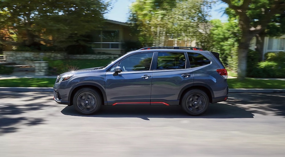 A grey 2024 Subaru Forester Sport is shown from the side.