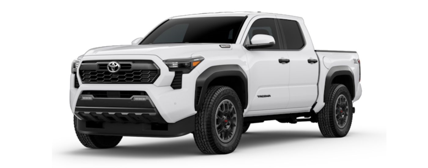 A white 2024 Toyota Tacoma angled left.