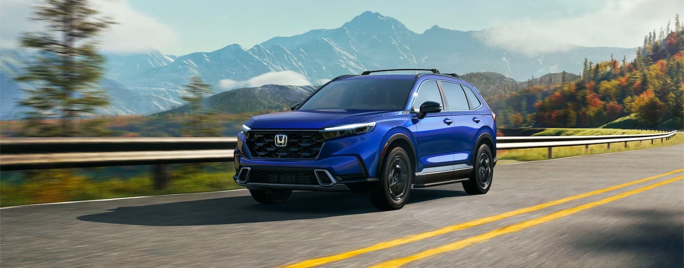 A blue 2023 Honda CR-V is shown from the front at an angle.