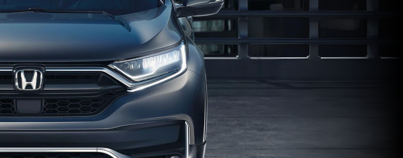 A close up shows the driver side headlight on grey 2020 Honda CR-V after leaving a certified Honda dealer.