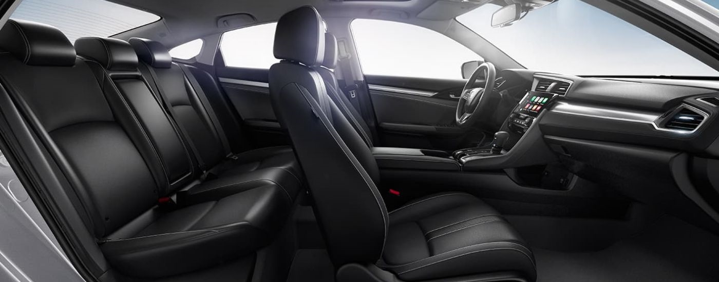 A close up shows the black leather seats in a 2016 Honda Civic.