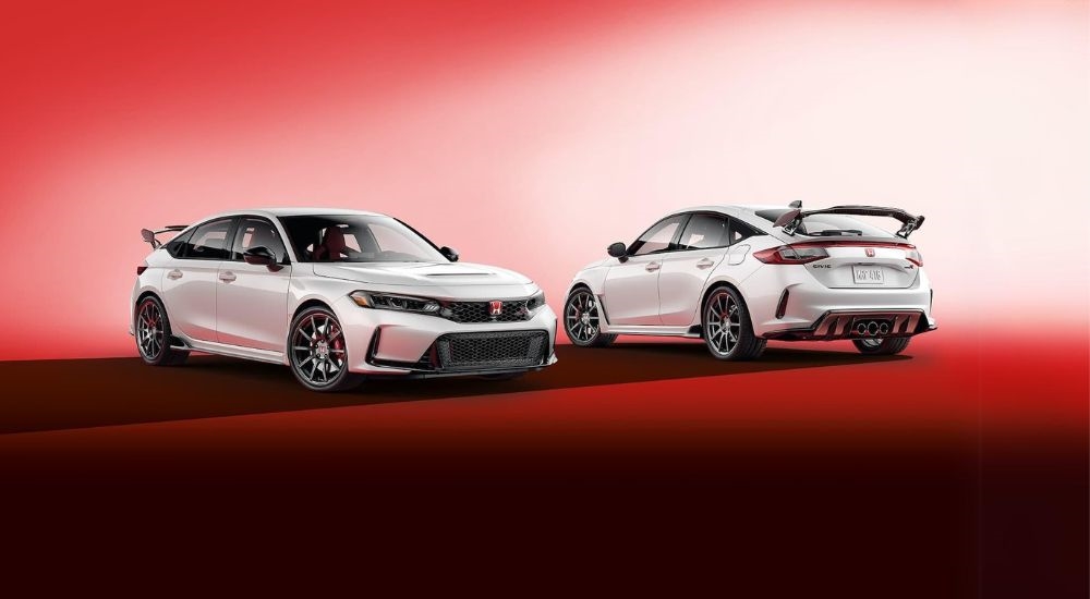 Two white 2024 Honda Civic Type R's are shown parked facing opposite directions.