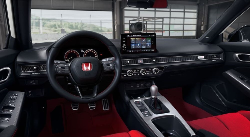 The black and red interior is shown in a 2024 Honda Civic Type R.