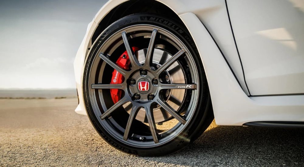 A close up shows a forged wheel on a 2024 Honda Civic Type R.