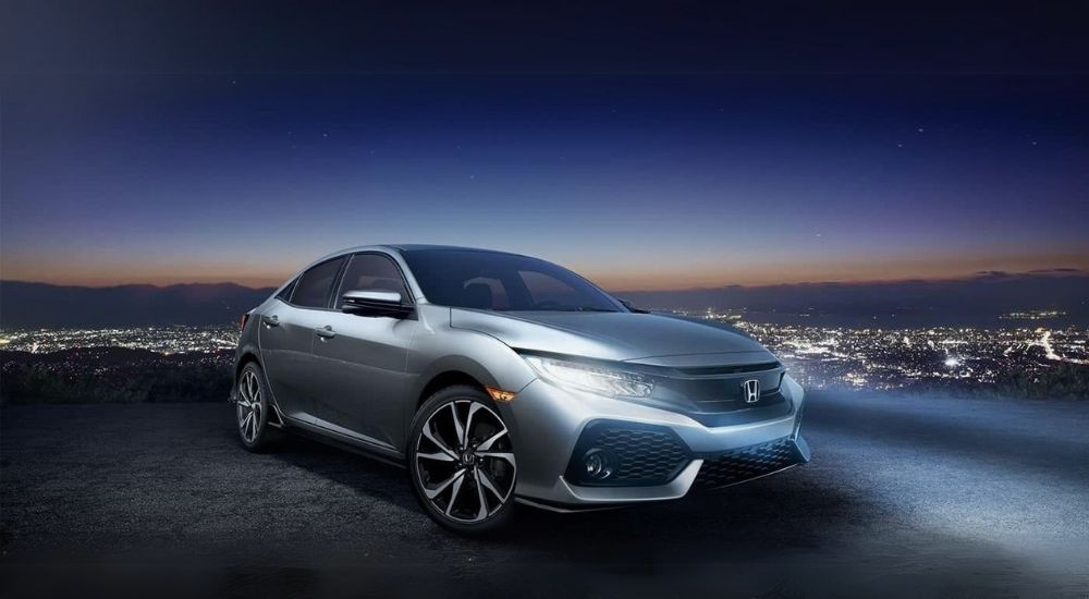 A silver Honda Civic is shown at an overlook after viewing used cars near Union City.