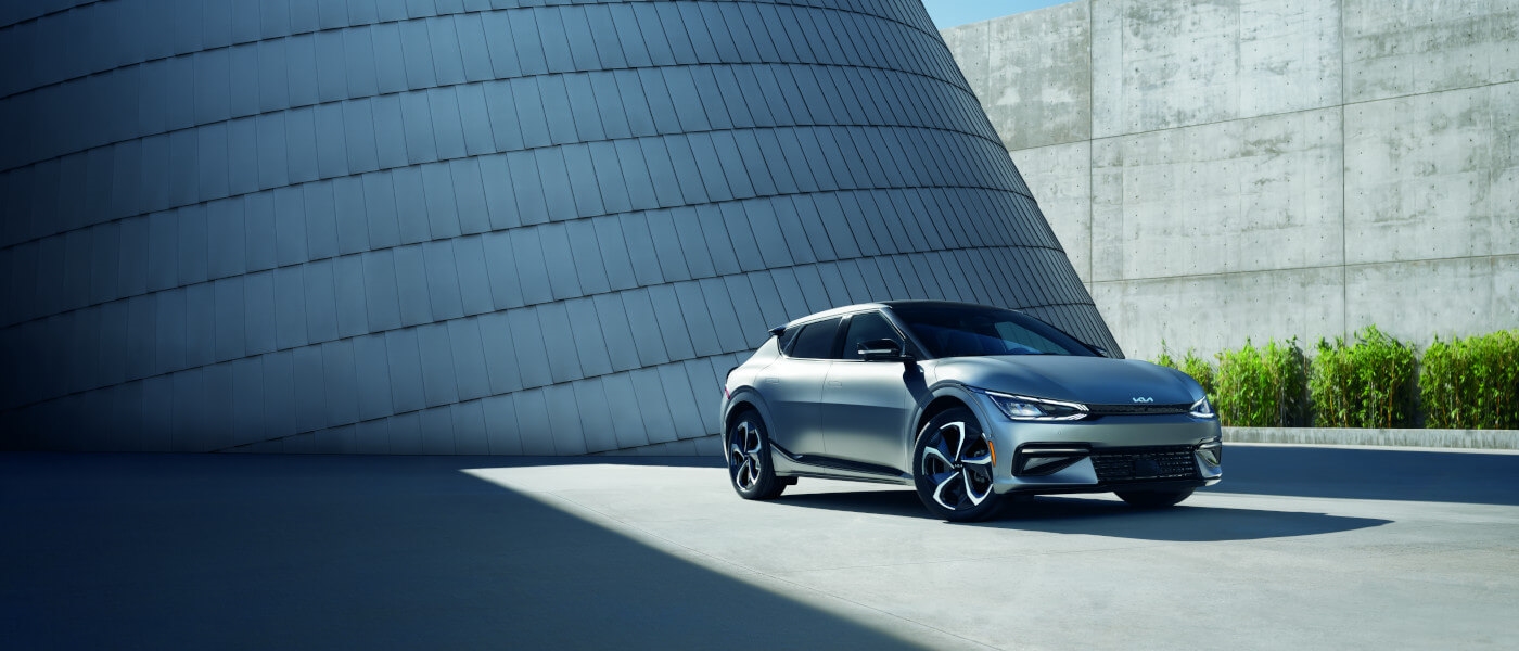 2024 Kia EV6 parked by a curved building