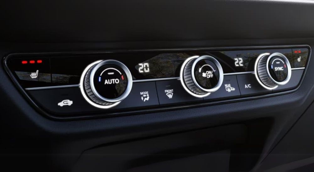 The HVAC controls are shown in a 2023 Honda HR-V for sale.
