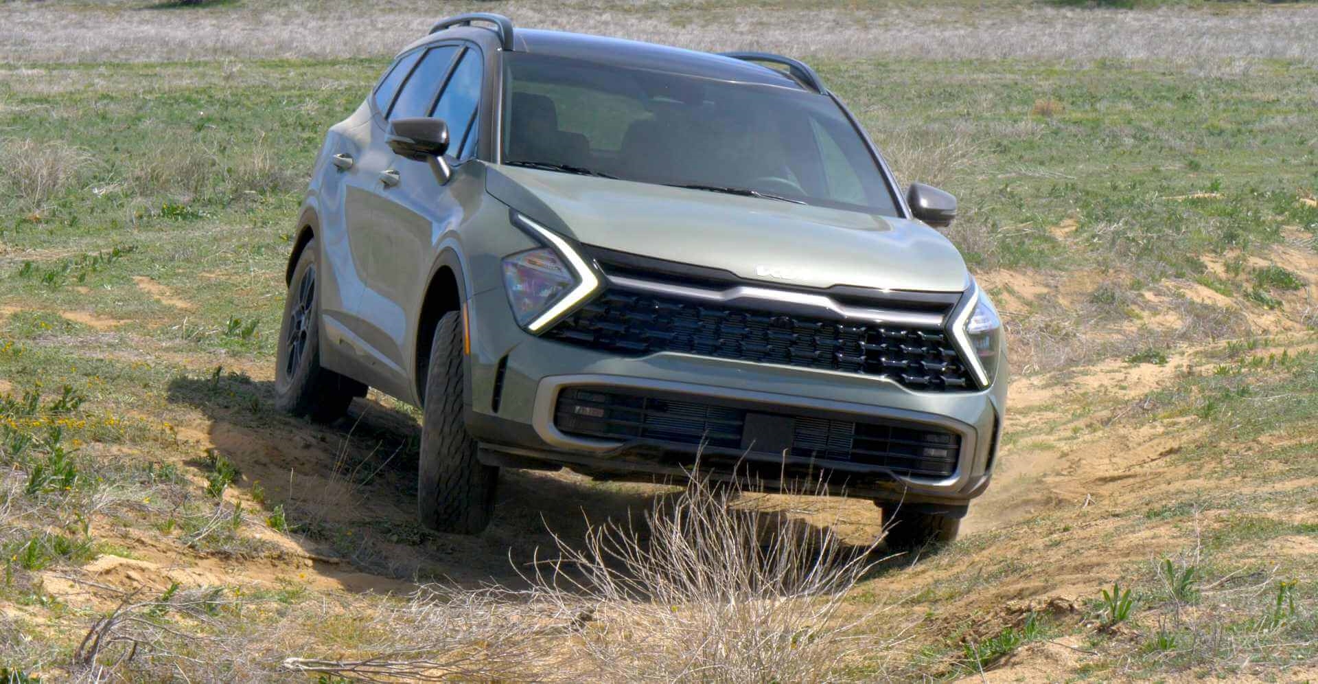 New green Kia Sportage X-Pro owner putting trust into reliability of the model by offroading in creek bed