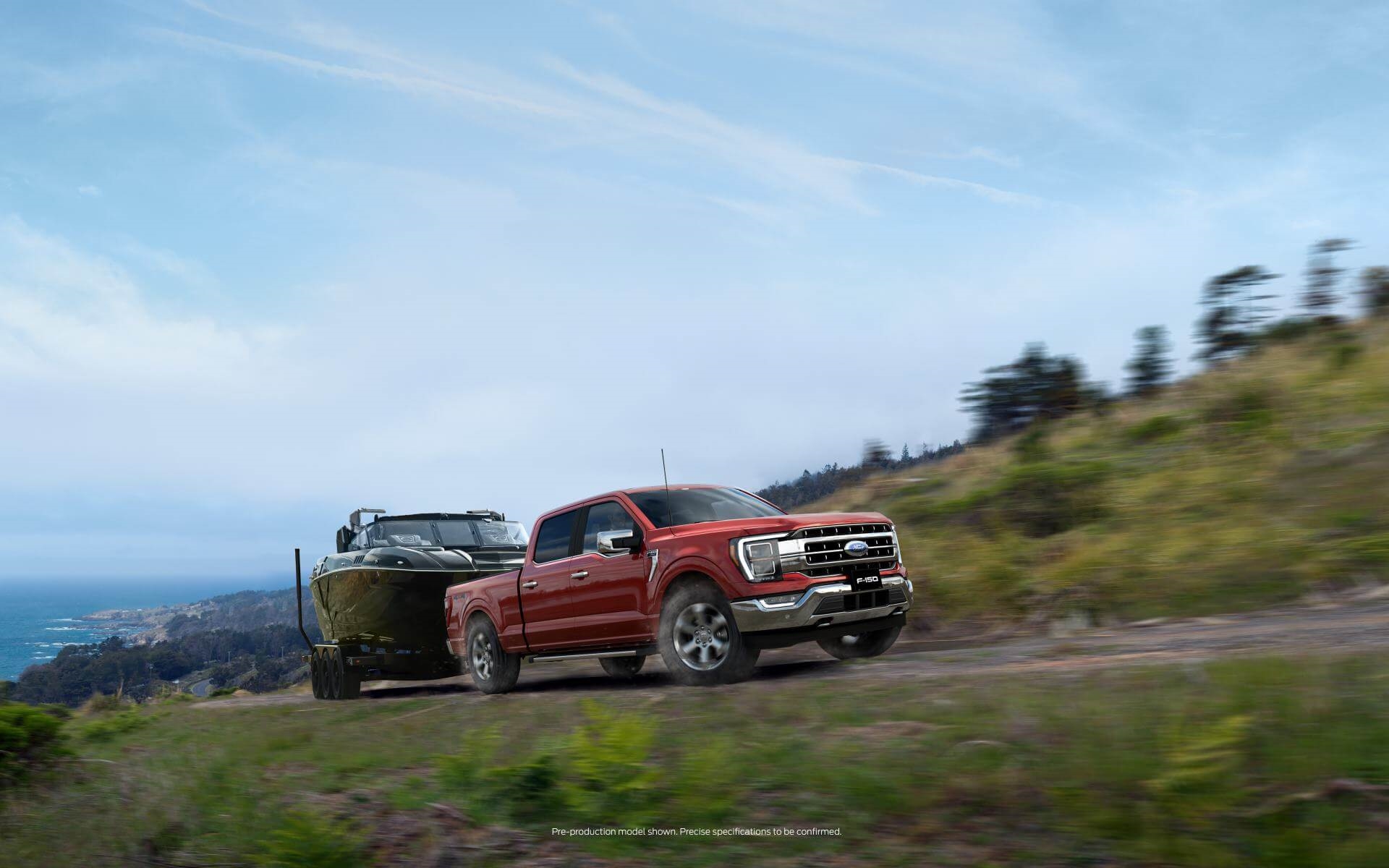 Ford F-150 towing a boat in the foothills of the Rocky Mountains