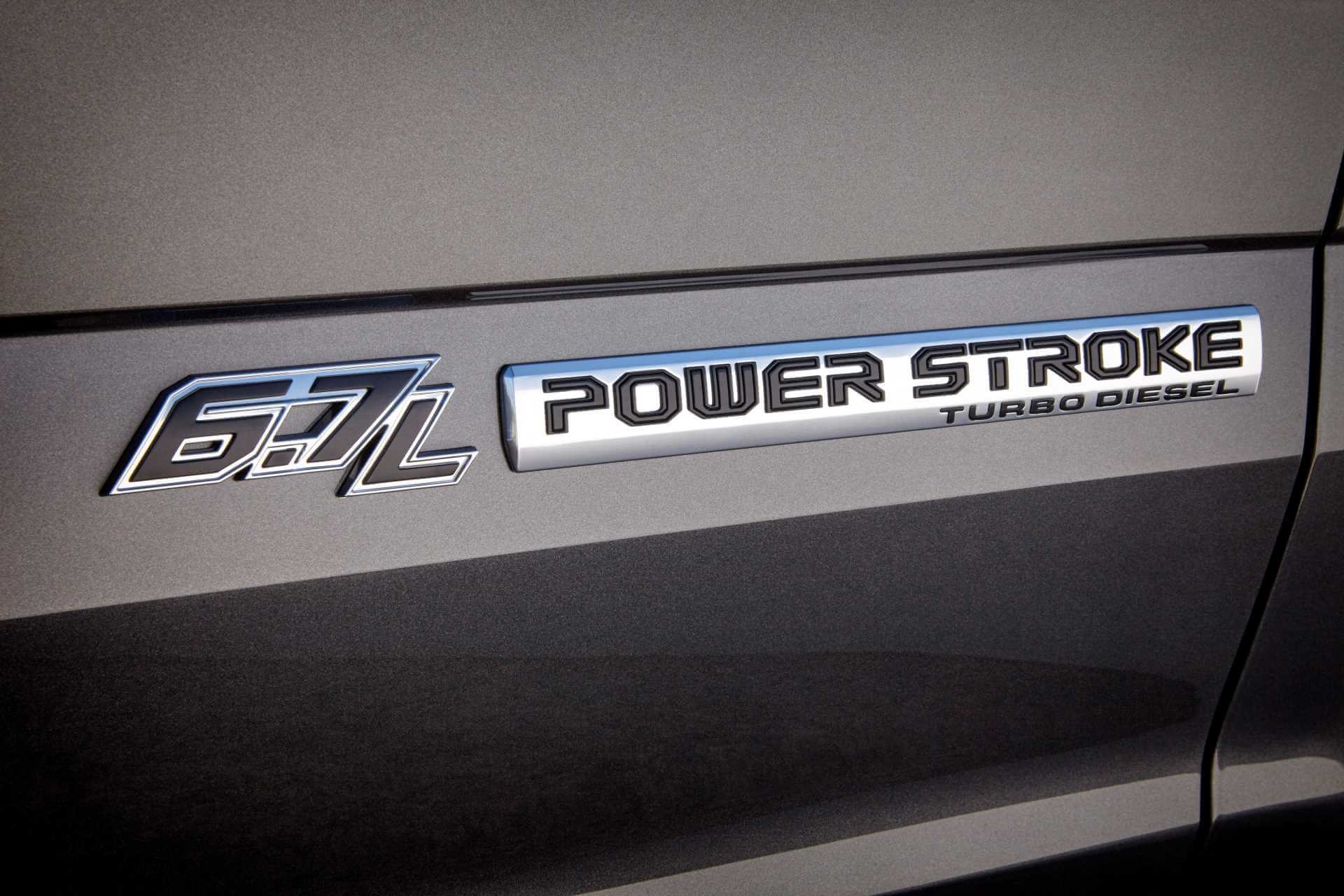 Exterior badge for the 6.7L Power Stroke Turbodiesel engine inside, upon a gray exterior vehicle