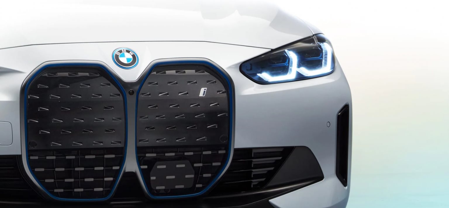 Pre-owned BMW luxury vehicles lined up at a dealership