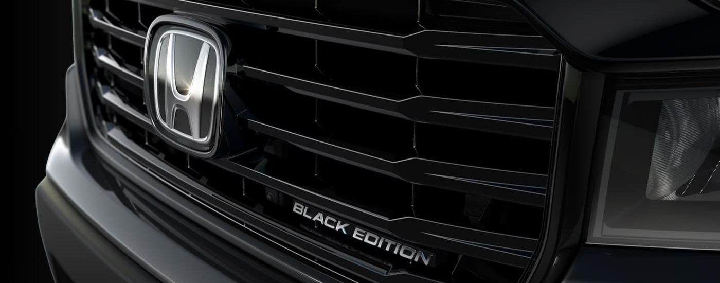 A close up shows the grille on a black  2023 Honda Ridgeline Black Edition.