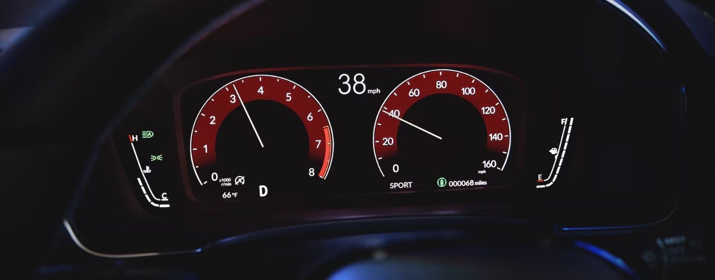 A close up shows the digital gauges in a 2024 Honda Civic.
