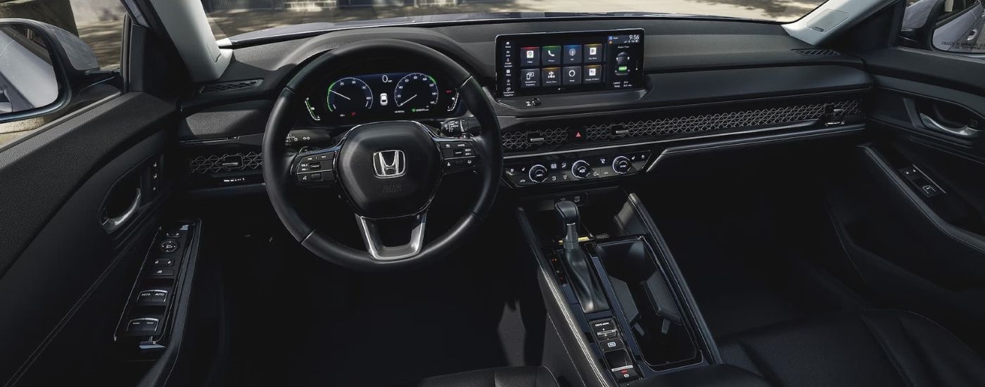 The black interior and dash of a 2024 Honda Accord is shown.