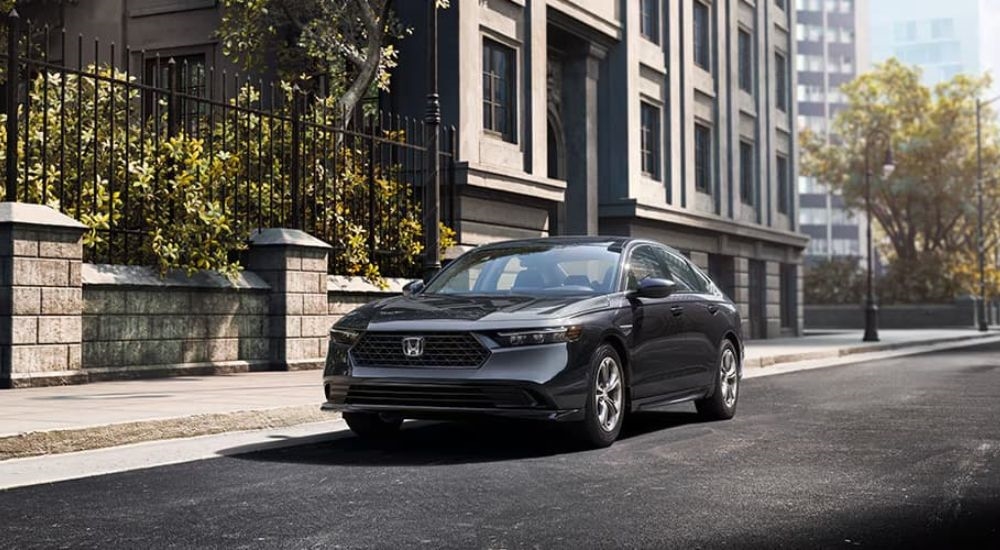 A grey  2023 Honda Accord EX is shown parked on a city street after leaving a Honda dealer near Marysville, WA.