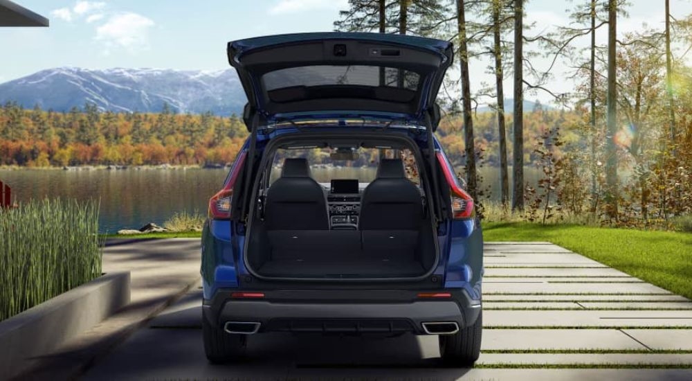 The open trunk of a blue 2023 Honda CR-V is shown.