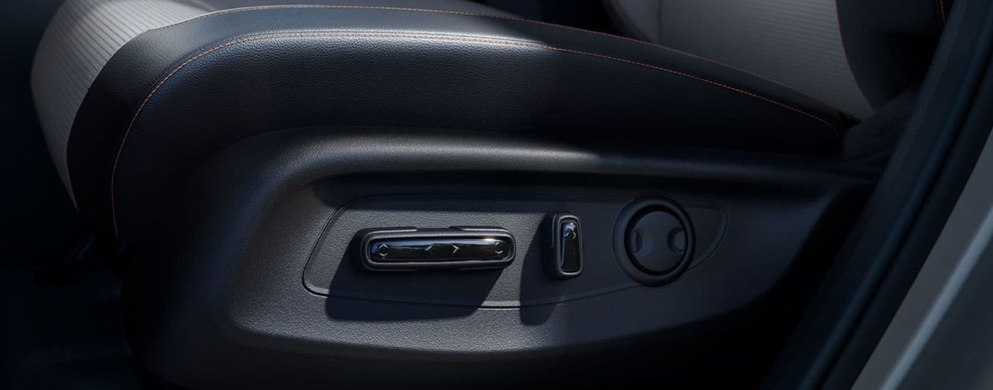 The black seat adjustment knobs are shown in a 2024 Honda CR-V