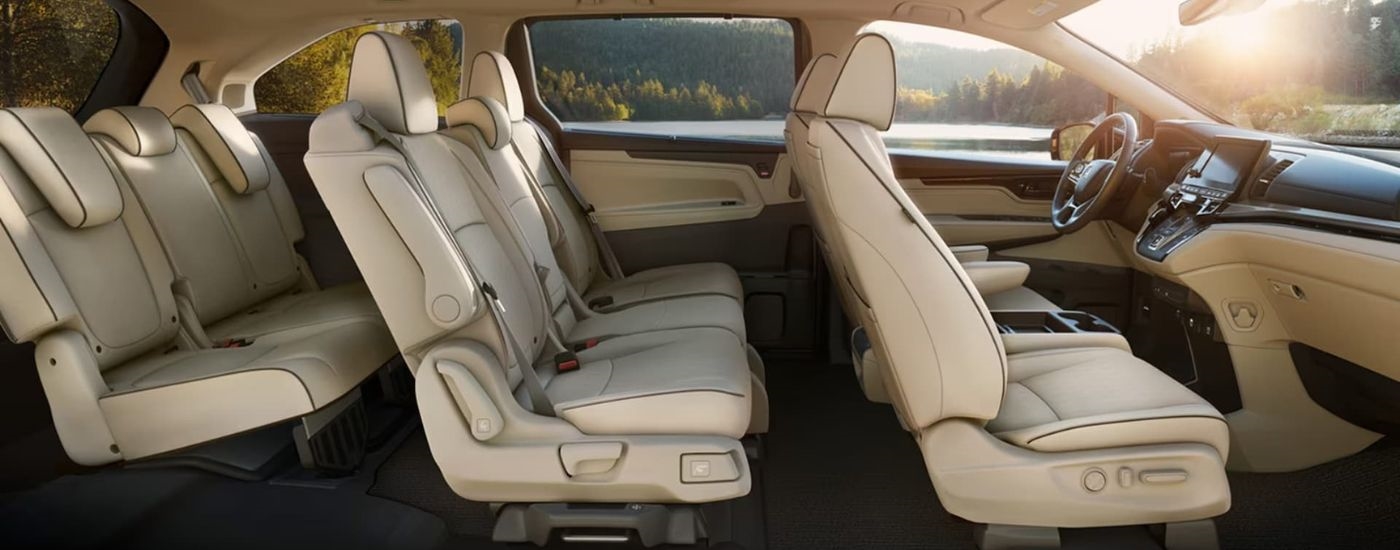 The tan interior of a 2024 Honda Odyssey is shown.