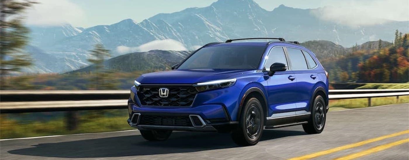 A blue 2023 Honda CR-V is shown from the front at an angle.