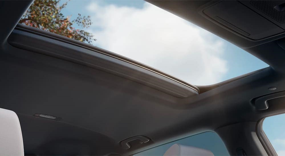 The open moonroof is shown in a 2023 Honda CR-V Hybrid Sport Touring.