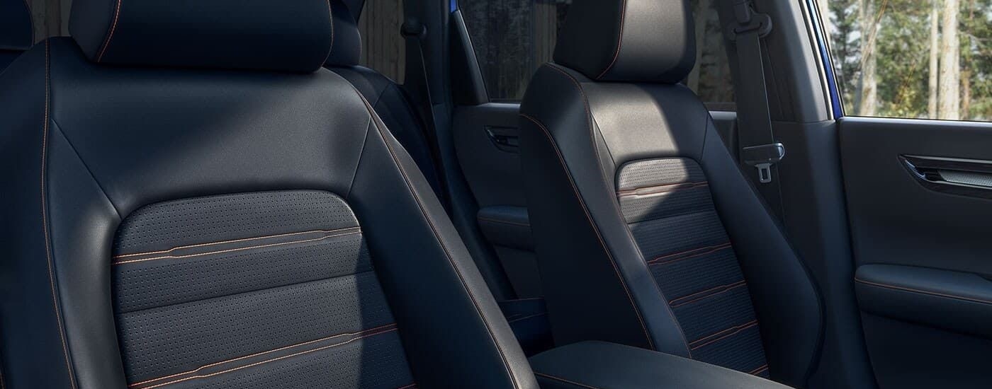 A close up shows the black leather seats in a 2024 Honda CR-V Hybrid.
