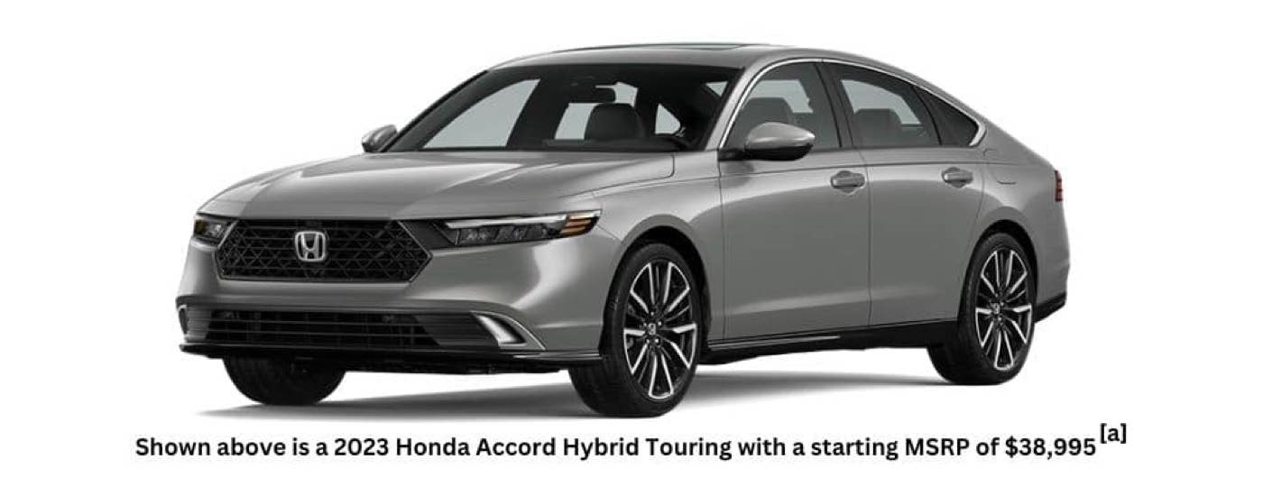 A silver 2023 Honda Accord Hybrid Touring is angled left.