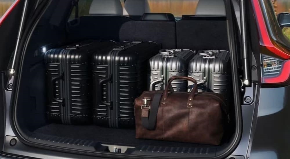 The rear cargo area on a gray 2024 Honda CR-V ST Hybrid is shown.