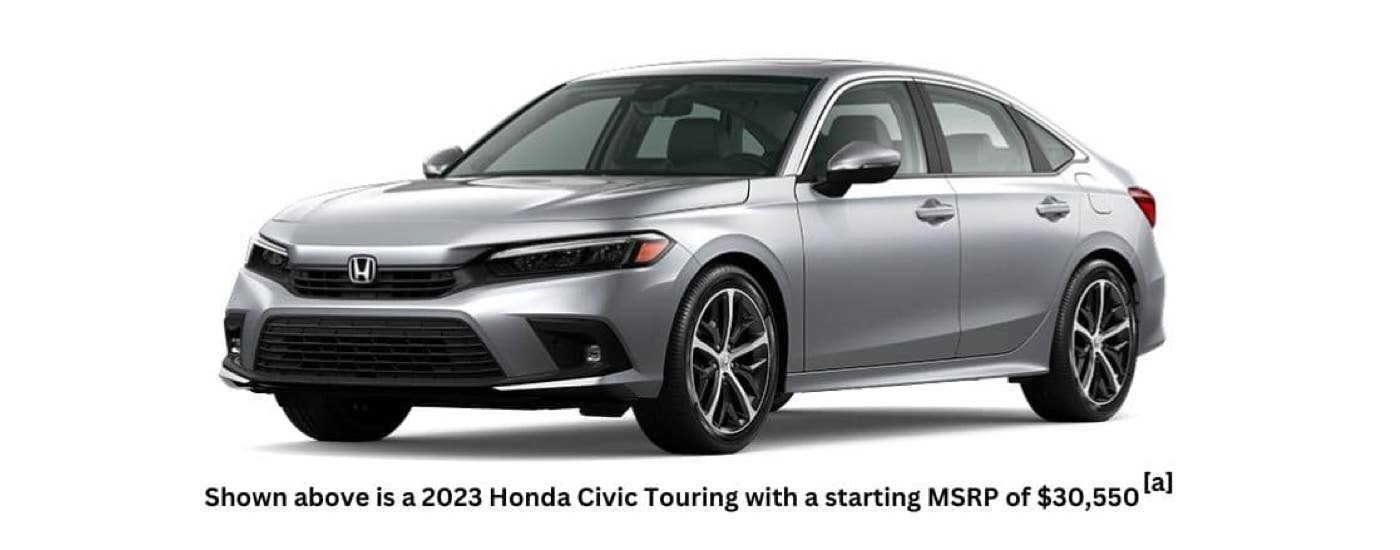 A silver 2023 Honda Civic Touring is angled left.
