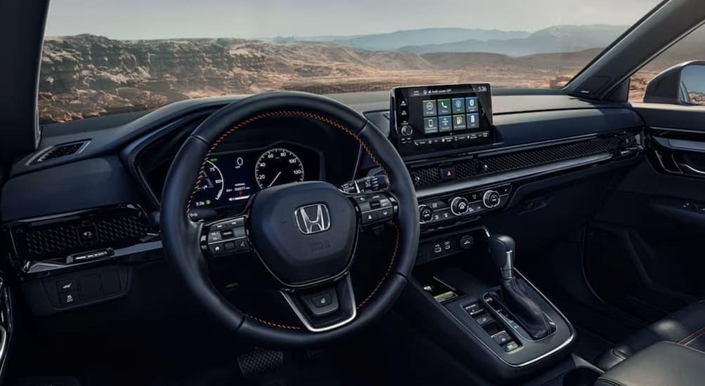 The black interior and dash in a 2024 Honda CR-V is shown.