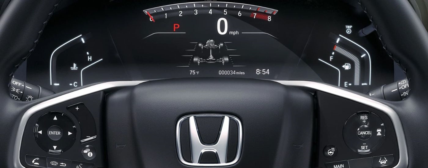 A close up shows the black interior and gague in a 2021 Honda CR-V.