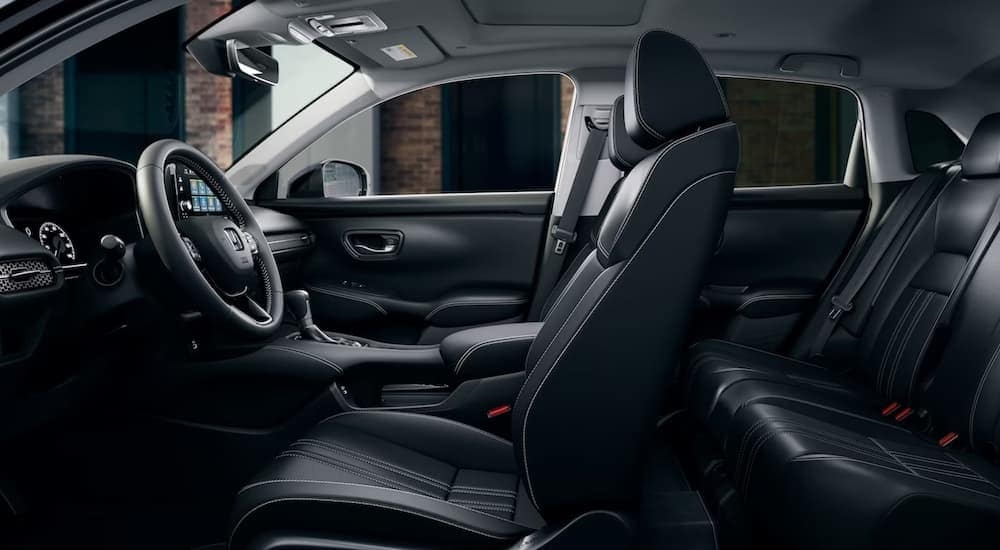 The black interior and dash of a 2024 Honda HR-V is shown.
