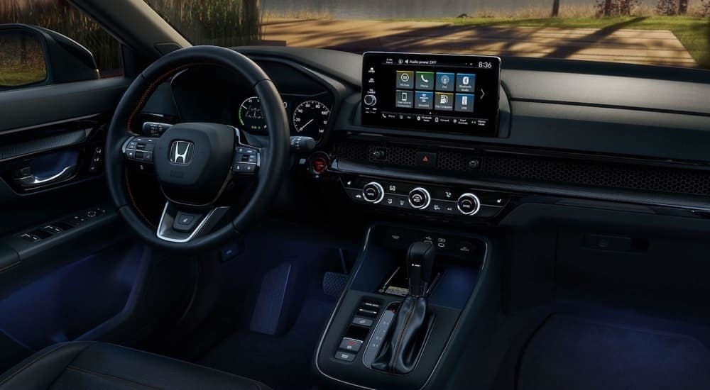 Blue ambient lighting in the cabin of a 2024 Honda CR-V Hybrid for sale near Lynnwood.
