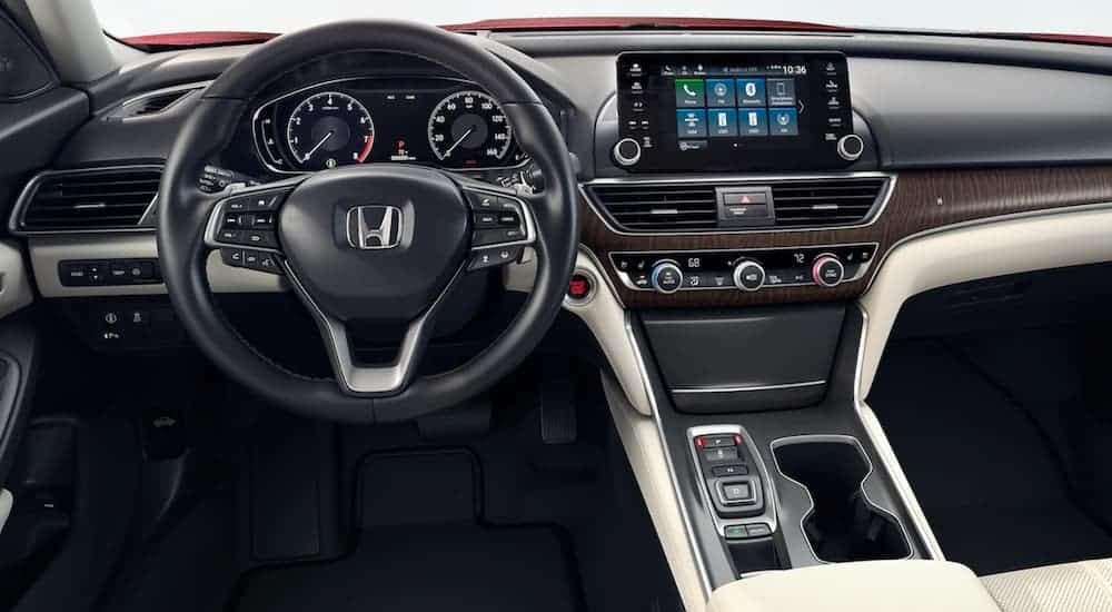 The black, brown, and white interior and dash in a 2020 Honda Accord is shown.