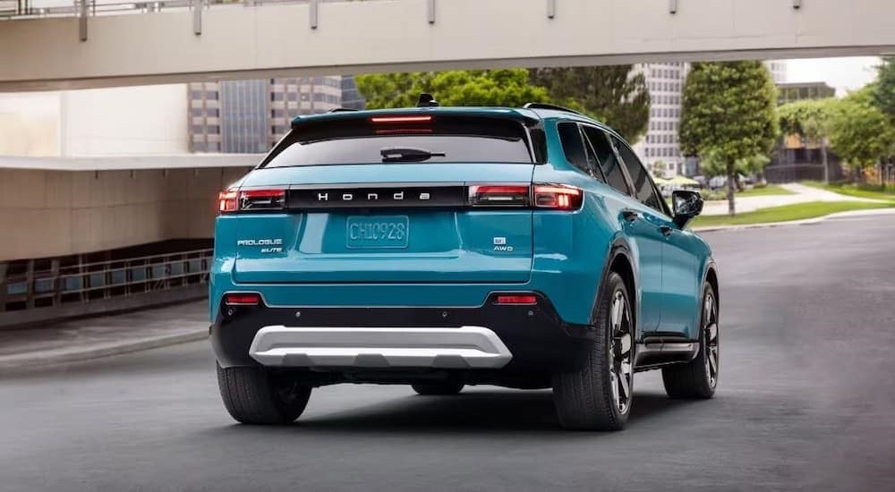 A teal 2024 Honda Prologue is shown from the rear at an angle after leaving a Lake Stevens Honda dealer.