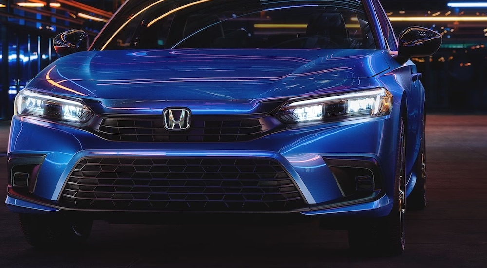 A blue 2024 Honda Civic is shown.