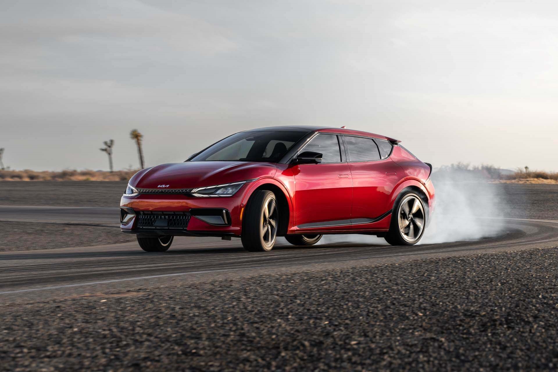 New Kia EV6 burning rubber on So Cal road at sunset.