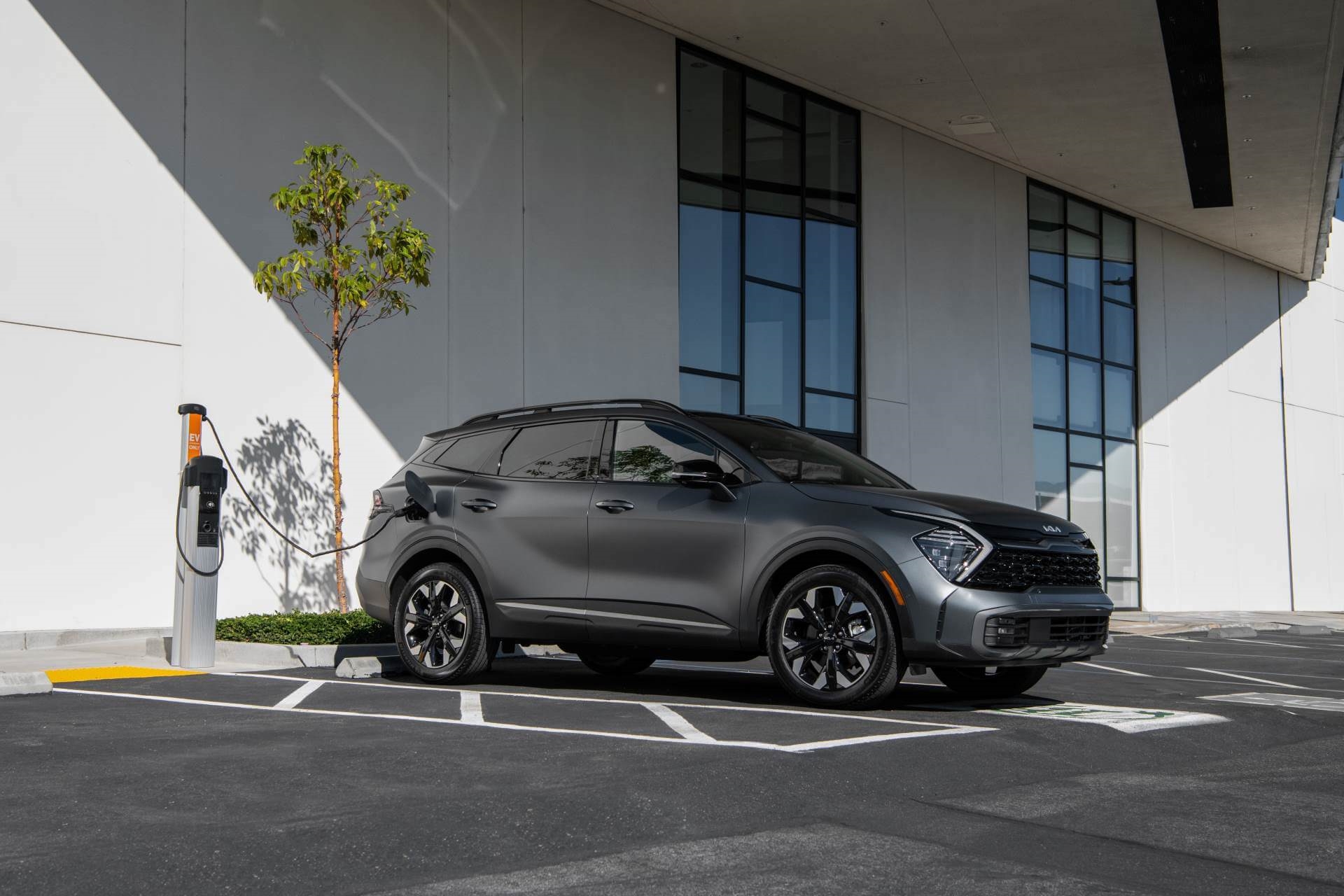 Kia Sportage being charged at an EV charging point