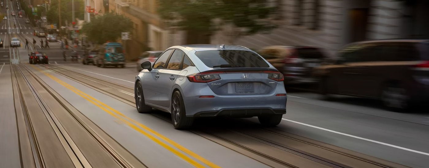 A grey 2022 Honda Civic Sport is shown from the rear.