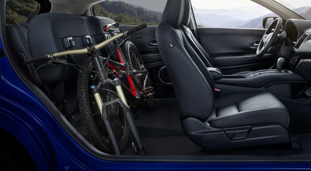 A bike is shown stowed in a blue 2021 Honda HR-V.
