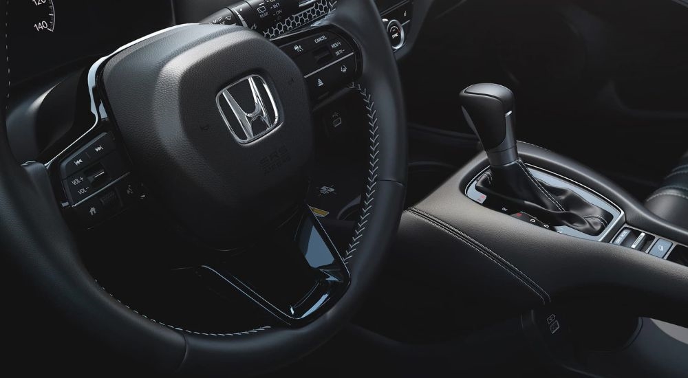 A close up shows the shifter and stering wheel in a 2025 Honda HR-V for sale.