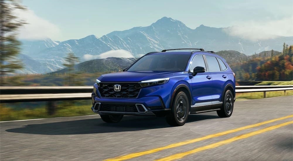 A blue 2023 Honda CR-V is shown from the front at an angle.